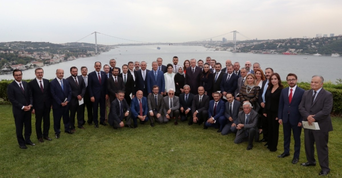 President Recep Tayyip Erdou011fan poses for a photo with Presidency officials, media executives and academics at the Vahdettin Mansion overlooking Bosporus, on July 14, 2019. (AA Photo)