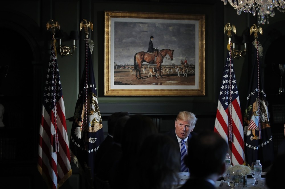 U.S. President Donald Trump meets with state leaders about prison reform, Thursday, Aug. 9, 2018, at Trump National Golf Club in Bedminster, New Jersey.