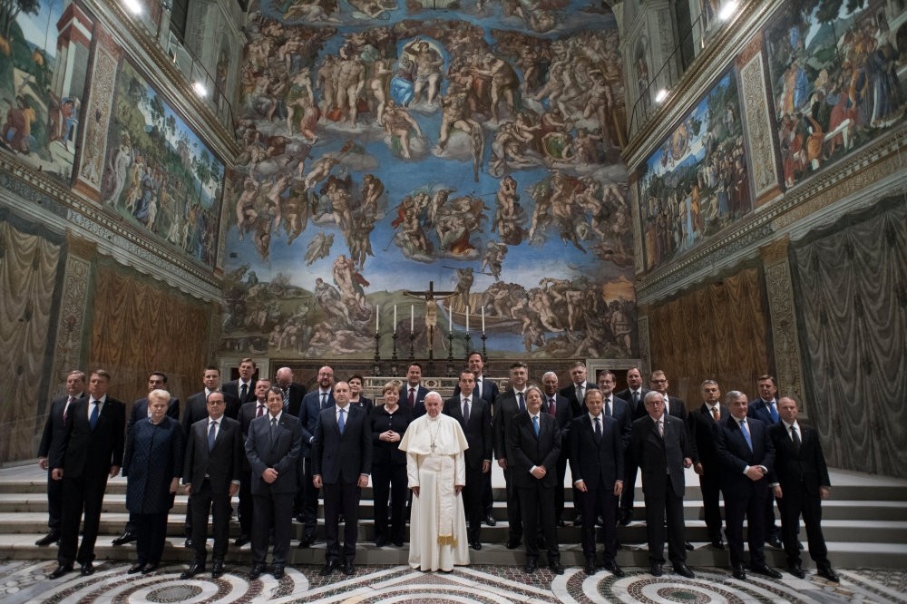 Pope Francis poses for a family picture in the Sistine Chapel after an audience with European Union leaders in Vatican, on March 24.
