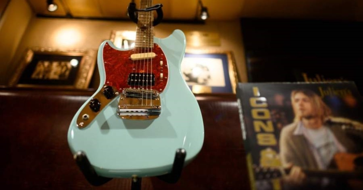 Kurt Cobain's custom-built left-handed Fender Mustang guitar that he used during Nirvana's In Utero tour is on display at the Hard Rock Cafe in New York City ahead of the auction of Julien's Auctions on October 21, 2019 in New York City. (AFP Photo)