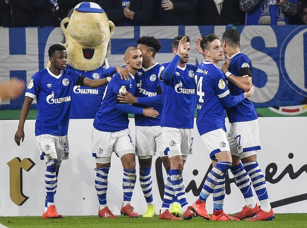 Kutucu (second left) celebrate after scoring the opening goal against Fortuna Duesseldorf in Gelsenkirchen, Germany, Feb. 6, 2019.