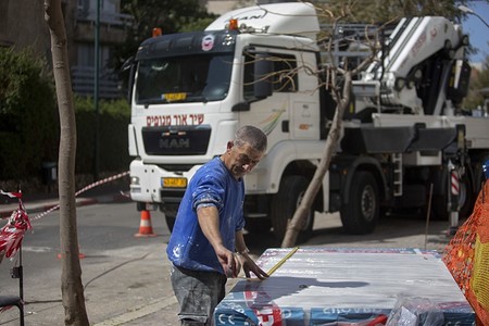 Palestinian construction worker Fuad Maraita works in the central Israeli city of Ramat Hasharon. (AP Photo