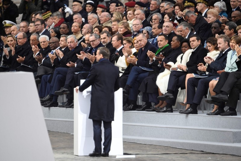 World leaders listen to French President Emmanuel Macron delivering a speech during in a ceremony at the Arc de Triomphe in Paris on Nov. 11, 2018 as part of commemorations marking 100th anniversary of the armistice ending World War I. (AFP Photo)