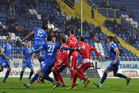 Footballers of Sarajevo's Zeljeznicar FC (blue jerseys) take part in a local match against Mladost FC (red jerseys).