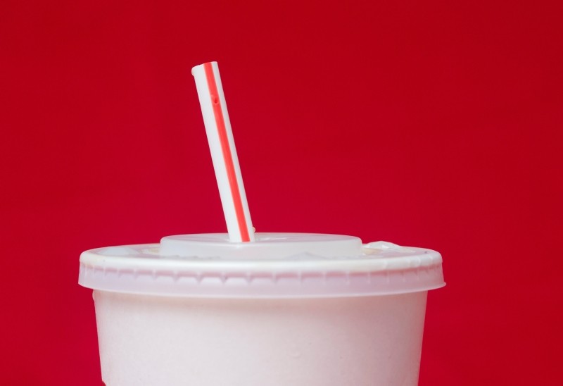 In this May 24, 2018, file photo, a large soft drink with a plastic straw from a McDonald's restaurant is shown in Surfside, Fla. (AP Photo)