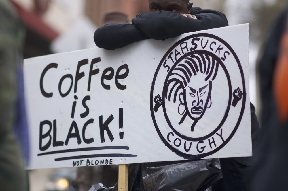 Protestor Jack Willis, 26, demonstrates outside a Starbucks on April 15, Philadelphia, Pennsylvania.