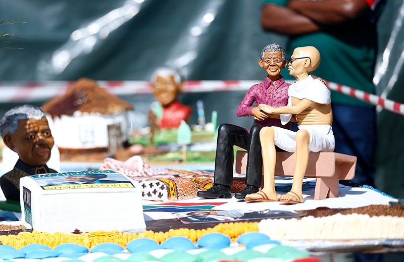 Edible figures of Nelson Mandela and Mahatma Gandhi form part of the 8-meter-long cake baked by The Cake Masters from Alexandra township to be viewed by community members in Johannesburg, South Africa.