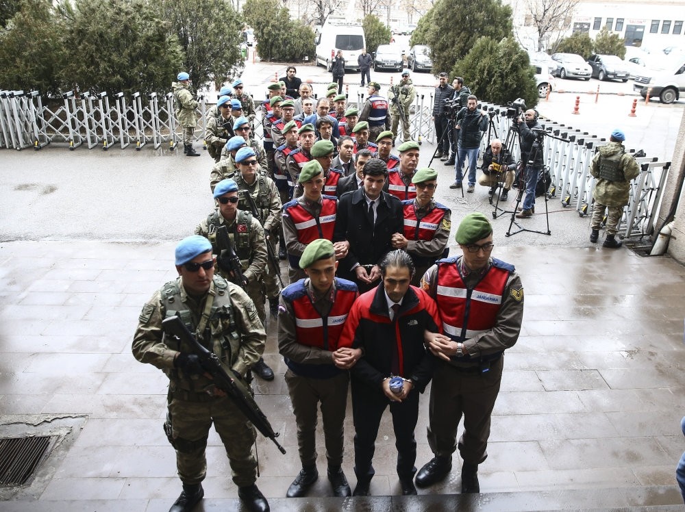 Gendarmes escort 18 defendants accused of involvement in the coup attempt and killing anti-coup hero u00d6mer Halisdemir in a previous hearing at a court in Ankara, in February 2017.
