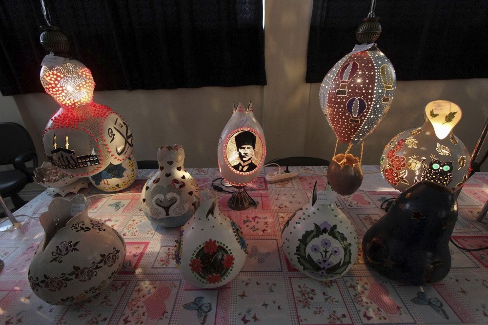 Women turn calabashes into decorative items such as lamps, chandeliers, baskets and flowerpots. (DHA Photo)