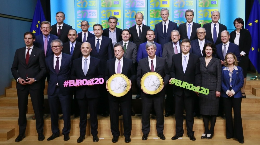 Eurozone finance ministers pose for a family photo during the Eurogroup Finance Ministers' meeting in Brussels, Belgium, Dec. 3