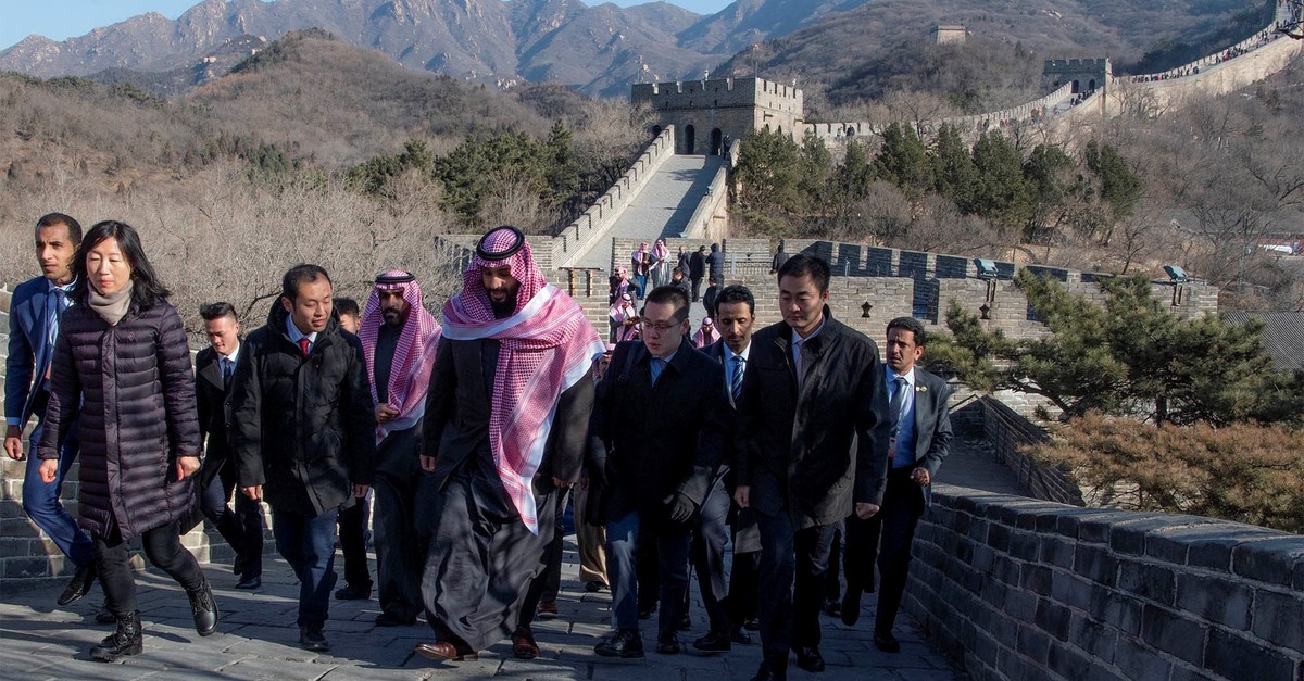 Saudi Arabia's Crown Prince Mohammed bin Salman walks with officials during his visit to Great Wall of China in Beijing, China, Feb. 21, 2019.