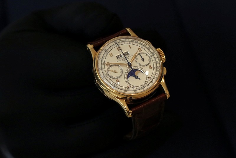 The Patek Philippe 18k gold perpetual chronograph wrist watch with moon phases belonging to the King Farouk is on display at the Christie's auction in Dubai, United Arab Emirates, March 19, 2018 (Reuters Photo)