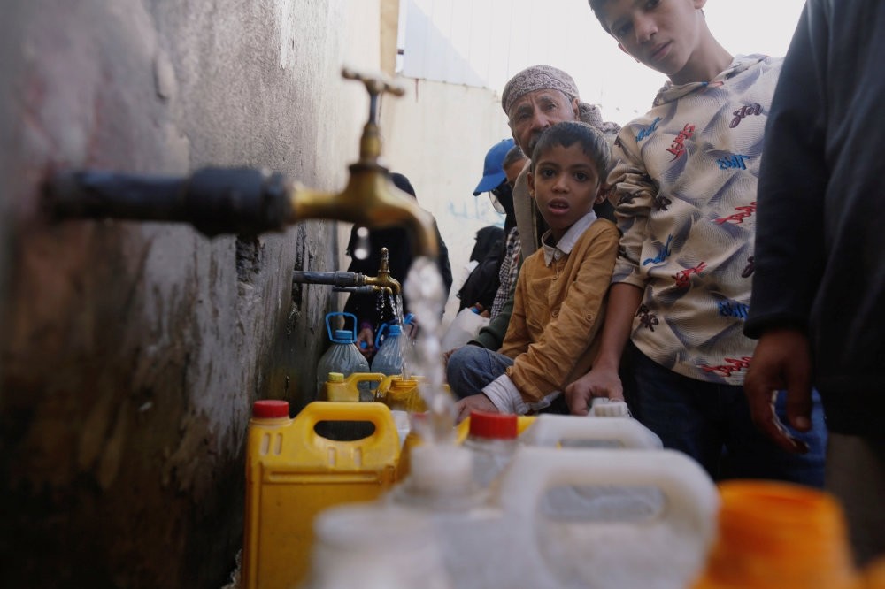 People collect drinking water from a charity tap amid fears of a new cholera outbreak in Sanaa, Yemen, Nov. 5. 