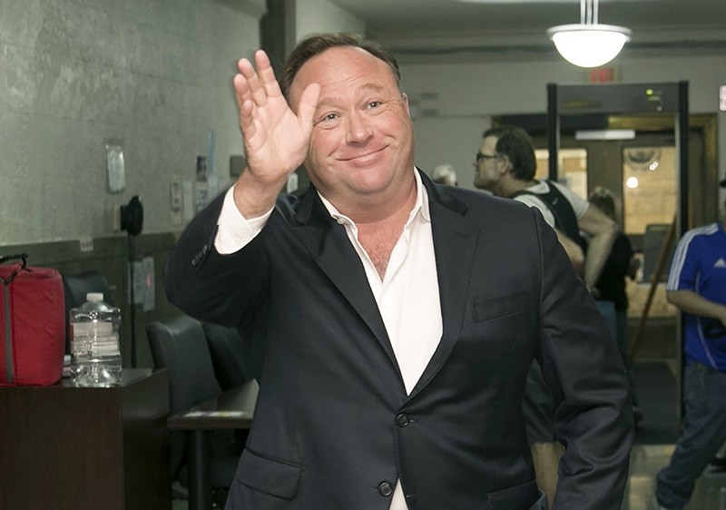 In this Wednesday, April 19, 2017, file photo, Alex Jones, a right-wing radio host and conspiracy theorist, arrives for a child custody trial at the Heman Marion Sweatt Travis County Courthouse in Austin, Texas. (AP Photo)