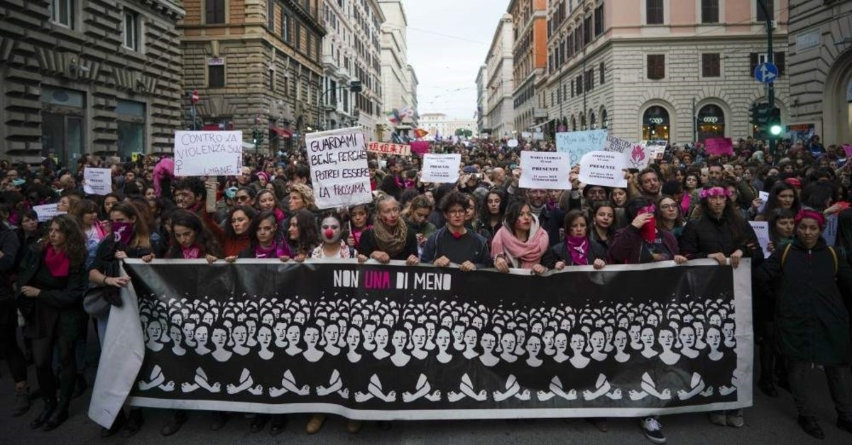Demonstrators march during a national rally protesting violence against women, Rome, Nov. 23, 2019. (AP Photo)