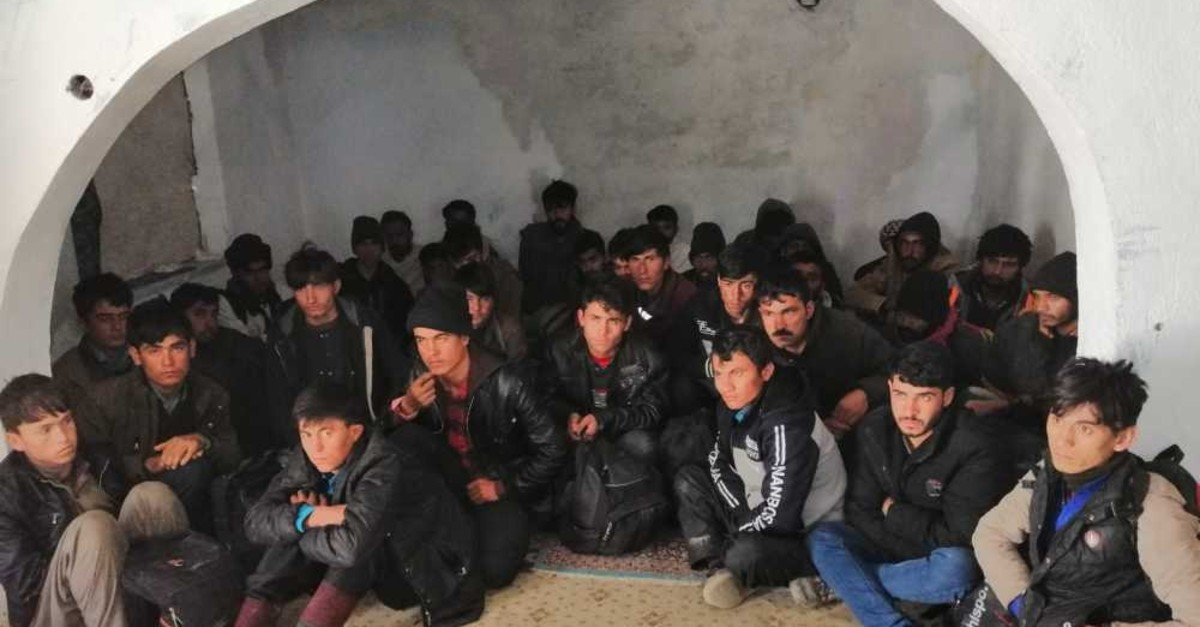 A group of illegal migrants huddled together in an abandoned building in the eastern province of Van. They were discovered hiding there by police on May 1, 2019, after sneaking into Turkey.