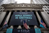 In this file photo taken on June 18, 2015, Fitbit banners decorate the exterior of the New York Stock Exchange during the IPO debut of the company in New York City. (AFP Photo)  