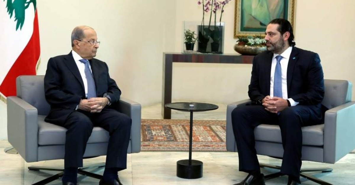 Lebanese President Michel Aoun (L) meets with Prime Minister Saad Hariri at the presidential palace, Baabda, Oct. 21, 2019. (AFP Photo)