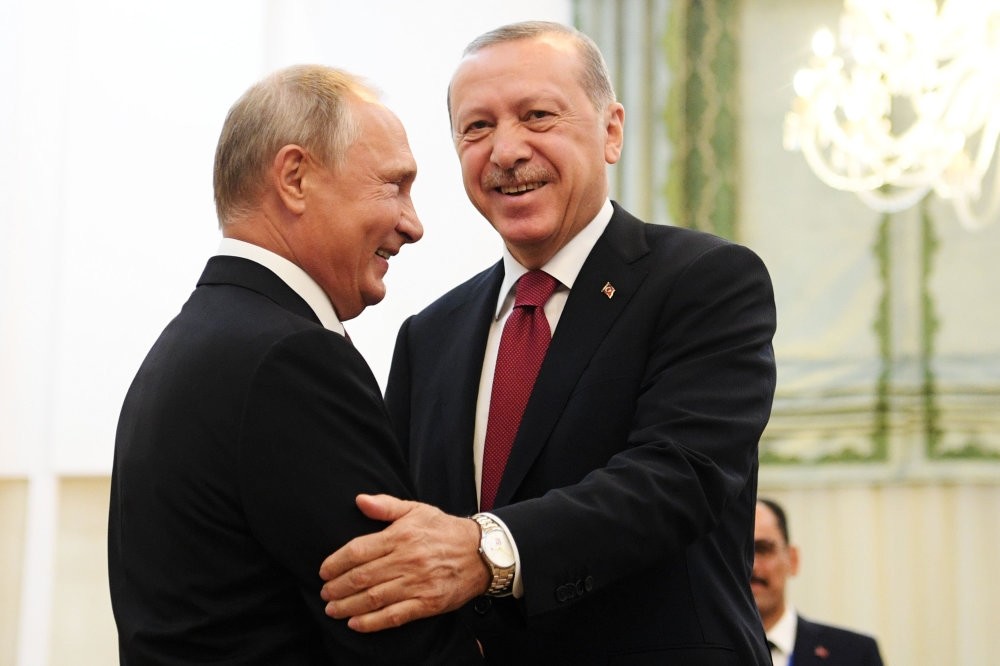 President Recep Tayyip Erdou011fan (R) shakes hands with Russian President Vladimir Putin during their meeting in Tehran, Sept. 7.
