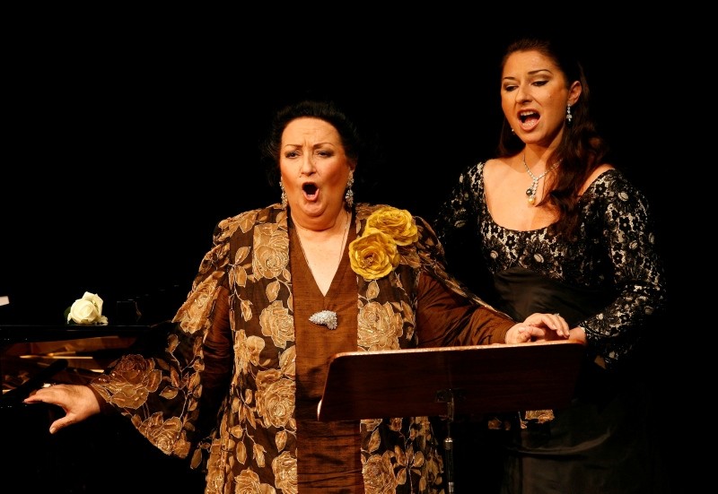 In this Nov. 17, 2006, file photo, Spanish soprano Montserrat Caballe, left, performs with her daughter Montserrat Marti, right, on the occasion of the celebration of her 50th stage anniversary in Basel, Switzerland. (AP Photo)
