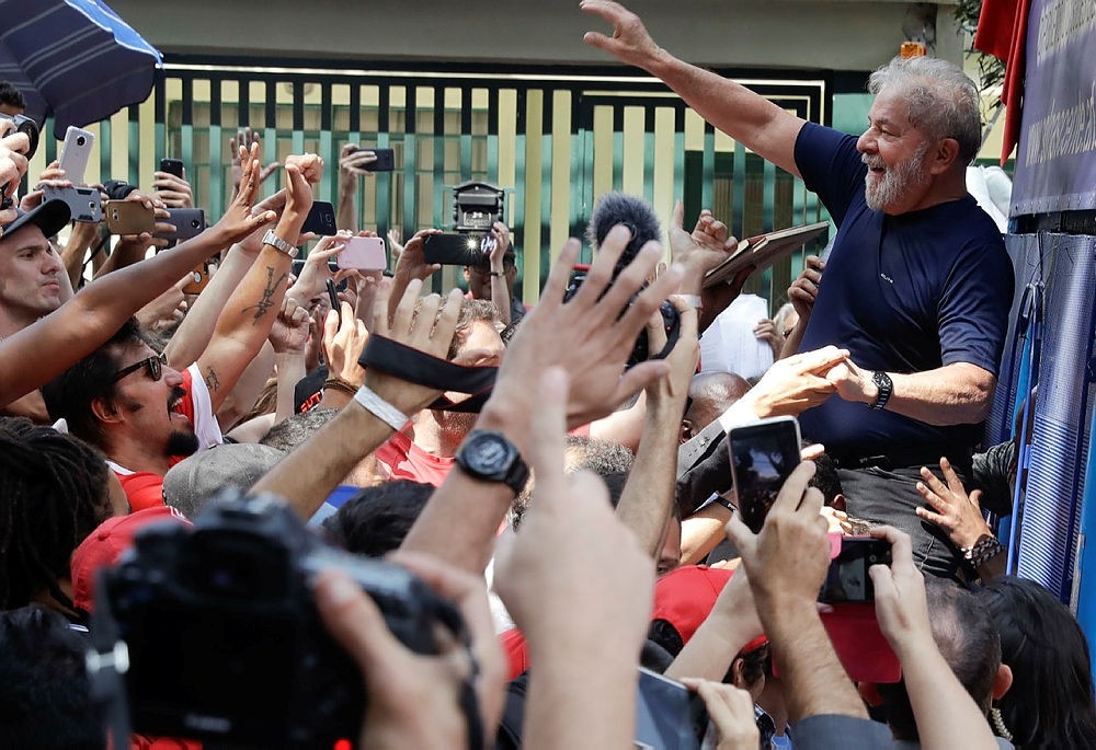 A photo of Brazil's imprisoned leftist leader Luiz Inacio Lula da Silva greeting his supporters. 