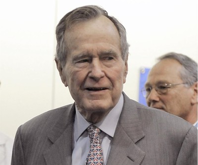 In a Tuesday, Dec. 2, 2008 file photo, former President George H. W. Bush leaves a news conference at the Houston hospital. (AP Photo)