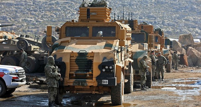 a convey of turkish forces are seen near the village of kafr karmin some 35