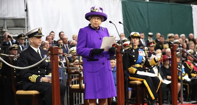 Britain's Queen Elizabeth II (C) gives an address as she attends the Commissioning Ceremony for the Royal Navy aircraft carrier HMS Queen Elizabeth at HM Naval Base in Portsmouth, southern England ( AFP Photo)