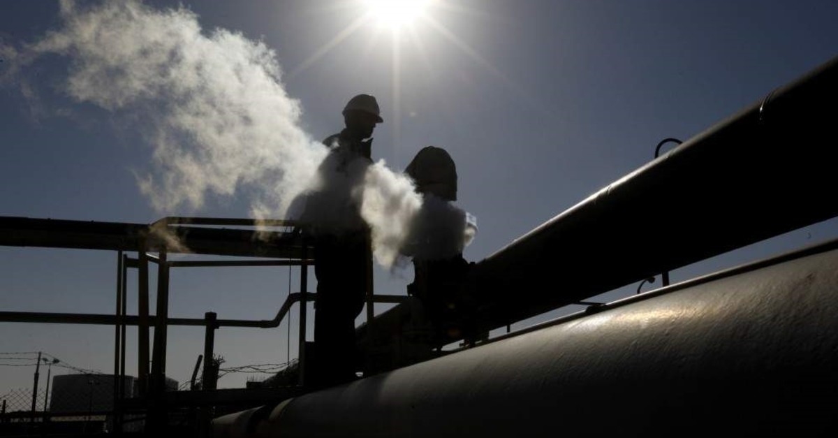 In this Feb. 26, 2011 file photo, a Libyan oil worker, works at a refinery inside the Brega oil complex, in Brega, eastern Libya. (AP Photo)