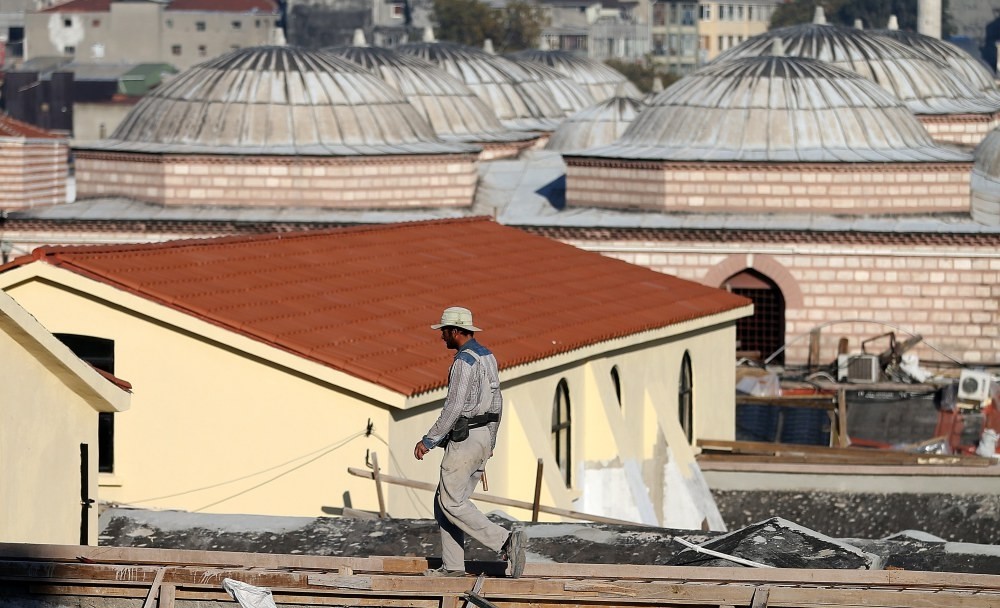 A restoration worker walks on the roof of the Grand Bazaar, Istanbul, Oct. 20. 