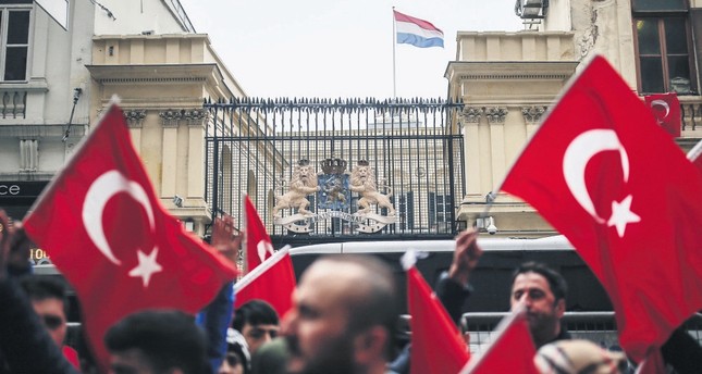 A group of Turkish people protesting the Dutch police's treatment of a Turkish minister in Rotterdam, outside the Dutch Consulate in Istanbul, March 12.