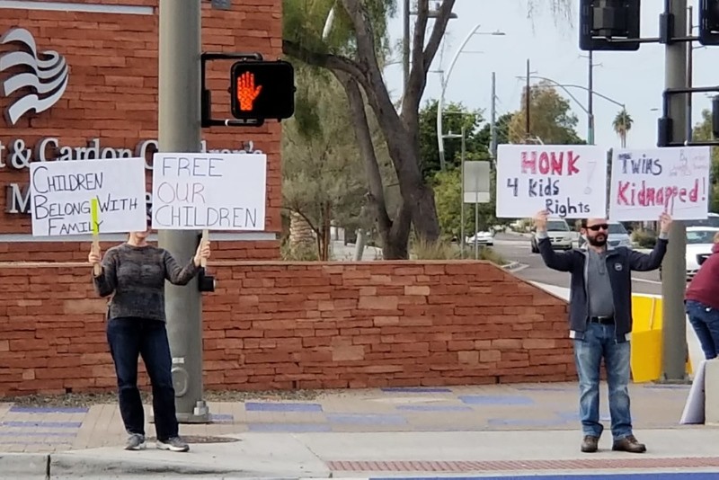 This photo published Jan. 6, 2019, shows people protesting against the removal of the Kahraman children from their family by the Arizona Department of Child Safety (DCS) in front of the Cardon Childrenu2019s Medical Center in Mesa, Ariz. (IHA Photo)