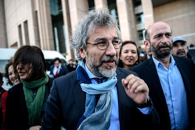This file photo taken on April 01, 2016 shows Cumhuriyet daily's editor-in-chief Can Du00fcndar (L) and Ankara bureau chief Erdem Gu00fcl arriving at the Istanbul courthouse for their trial. (AFP Photo)