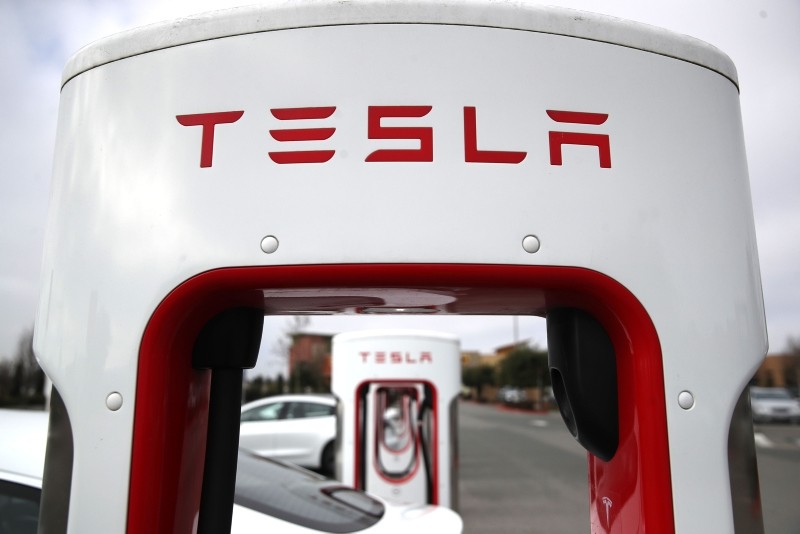In this file photo taken on January 30, 2019, Tesla cars recharge at a Tesla Supercharger facility on in Petaluma, California. (AFP Photo)