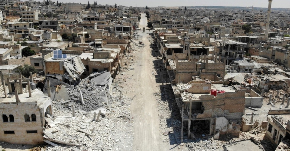 This file aerial view taken on August 3, 2019, shows destroyed buildings in the town of Khan Sheikhun in the southern countryside of the northwestern Idlib province. (AFP Photo)