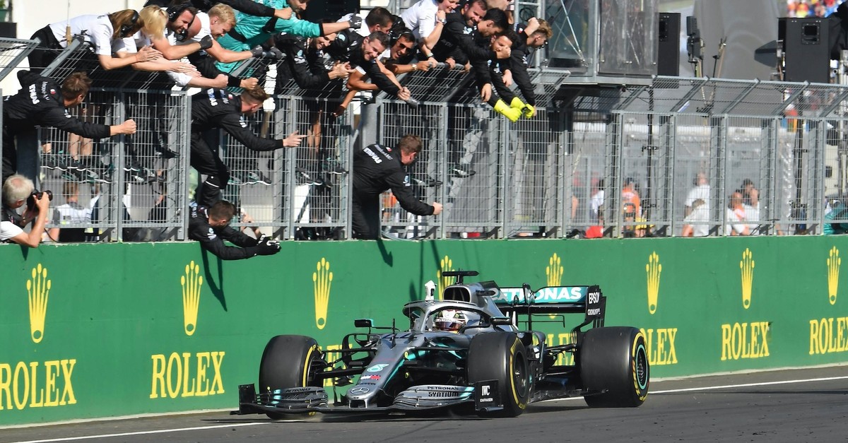 Mercedesu2019 British driver Lewis Hamilton celebrates with his teammates after winning the Formula One Hungarian Grand Prix at the Hungaroring circuit in Mogyorod near Budapest, Hungary, Aug. 4, 2019. 