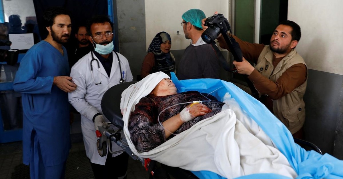 Men carry an injured woman at a hospital after a suicide attack in Kabul, Afghanistan June 11, 2018 (Reuters Photo)