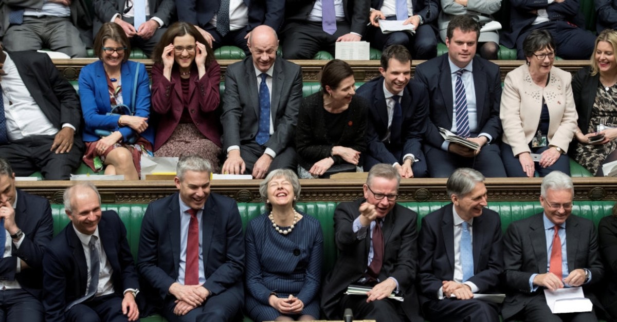 Britain's Prime Minister Theresa May reacts during the debate on extending the Brexit negotiating period in Parliament in London, March 14, 2019. 