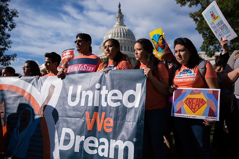 Protesters chant slogans during a news conference with DACA recipients and pro-immigrant advocacy groups to demand passage of a 'Clean Dream Act', at the U.S. Capitol in Washington, D.C., U.S., Oct. 5, 2017. (EPA Photo)