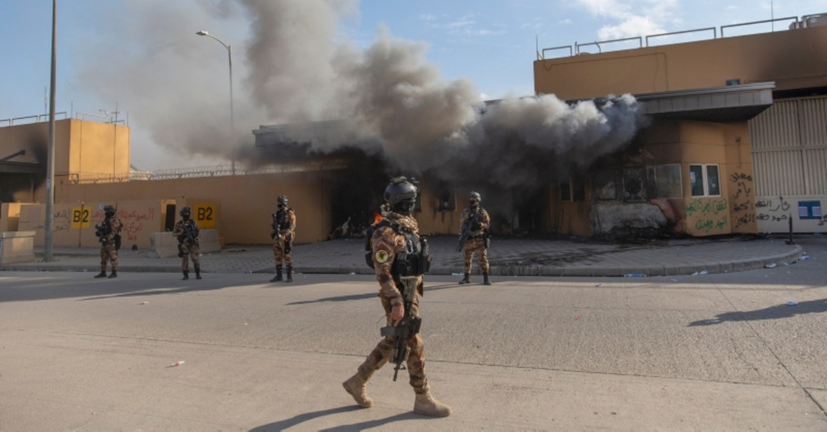 Iraqi army soldiers are deployed in front of the U.S. embassy, in Baghdad, Iraq, Wednesday, Jan. 1, 2020. (AP Photo)