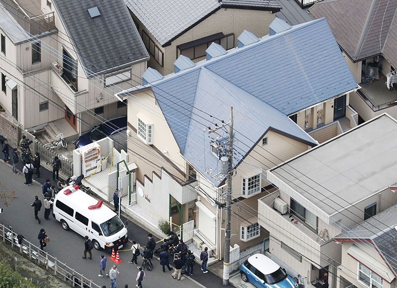 This aerial photo shows the apartment, center, where police found dismembered bodies in coolers in Zama city, southwest of Tokyo, Tuesday, Oct. 31, 2017. (Kyodo News via AP)