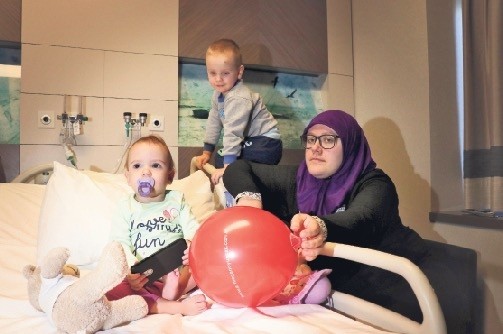 Edina Muharemovic, 26, sitting beside her daughter Asija in an Istanbul hospital.