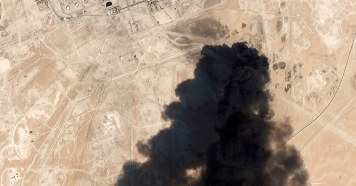 This Saturday, Sept. 14, 2019, satellite image from Planet Labs Inc. shows thick black smoke rising from Saudi Aramco's Abqaiq oil processing facility in Buqyaq, Saudi Arabia. (Planet Labs Inc via AP)