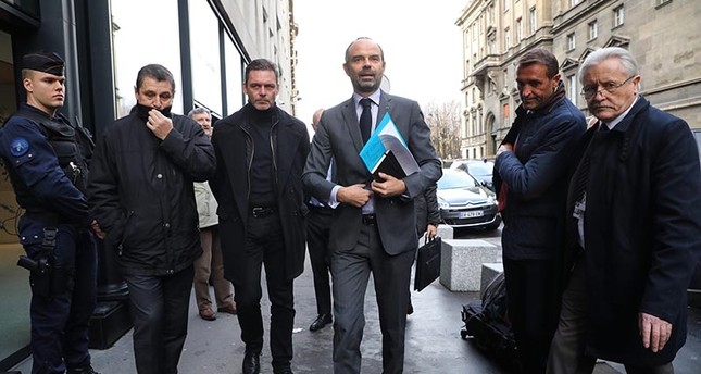 French Prime Minister Edouard Philippe arrives to announce the suspension on rising fuel taxes in Paris on Dec. 4, 2018. (AFP Photo)