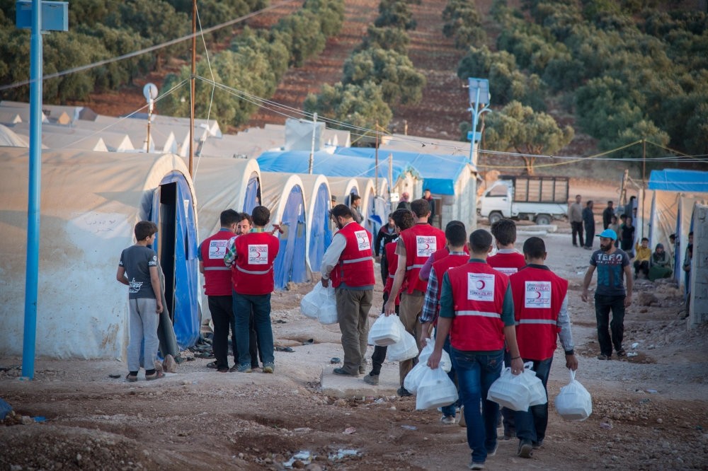 The Turkish Red Crescent is distributing food to 12,000 internally displaced people in its camps in Idlib.