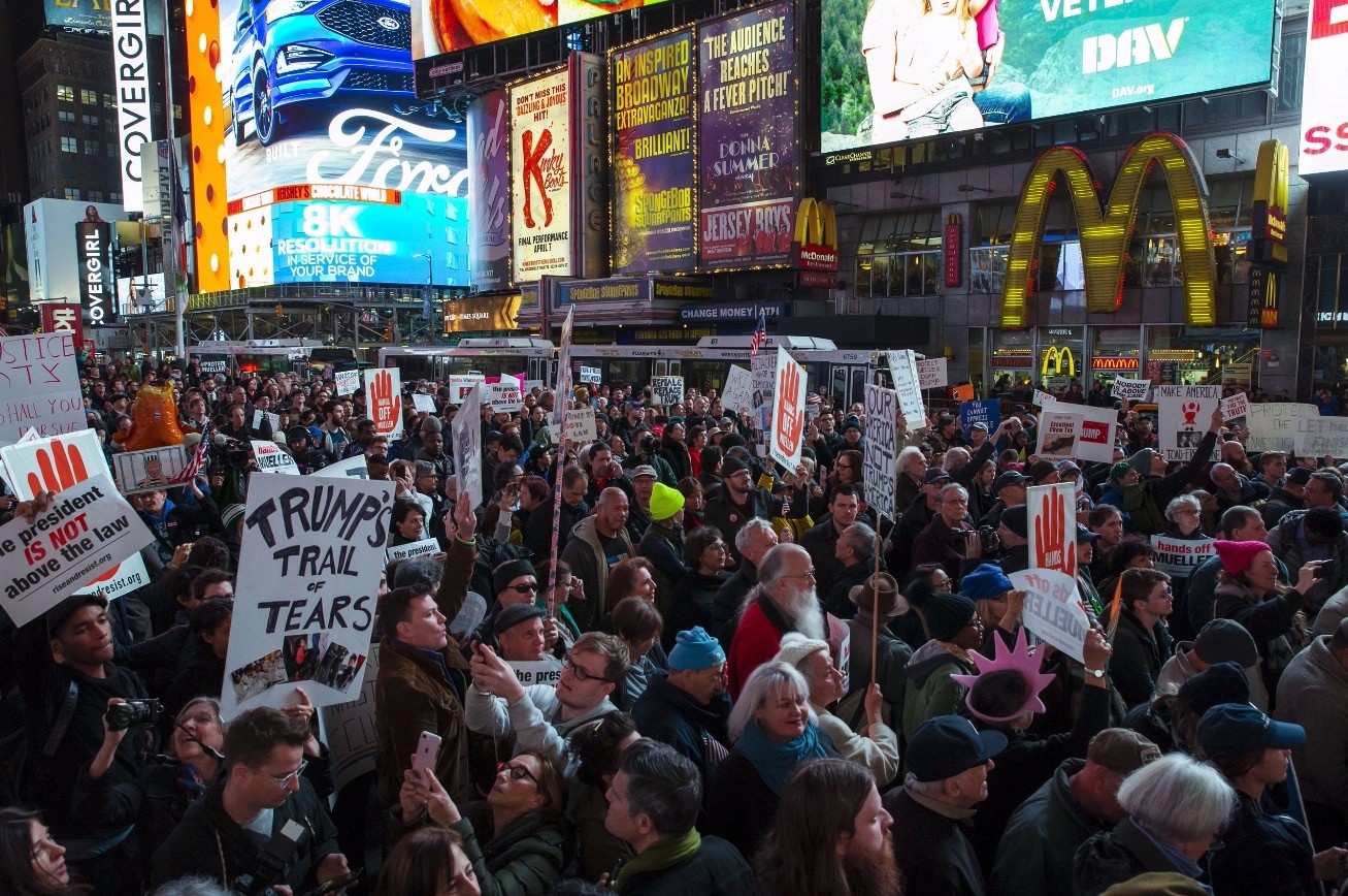 People attend a protest in Times Square the day after President Donald Trump forced the resignation of Attorney General Jeff Sessions, New York City, Nov. 8.