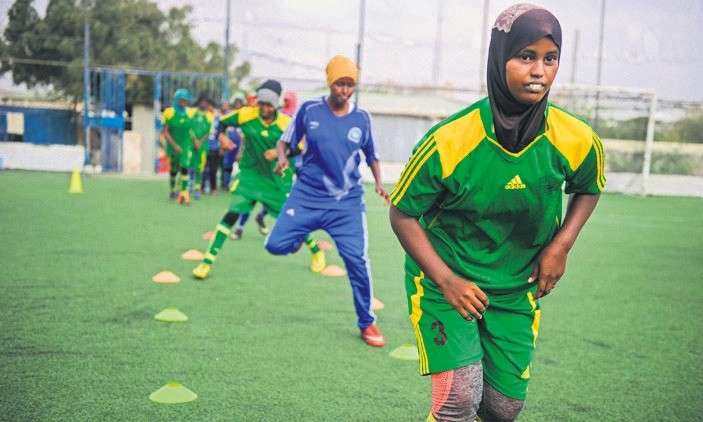 Somali football players of Golden Girls Football Centre, Somalia's first female soccer club, attend their training session at Toyo stadium.