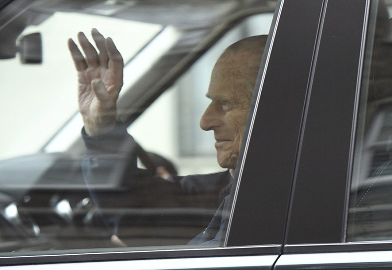 Britain's Prince Philip waves as he leaves the King Edward VII Hospital, after recovering from a planned surgery last Wednesday, in London, Friday, April 13, 2018. (AP Photo)