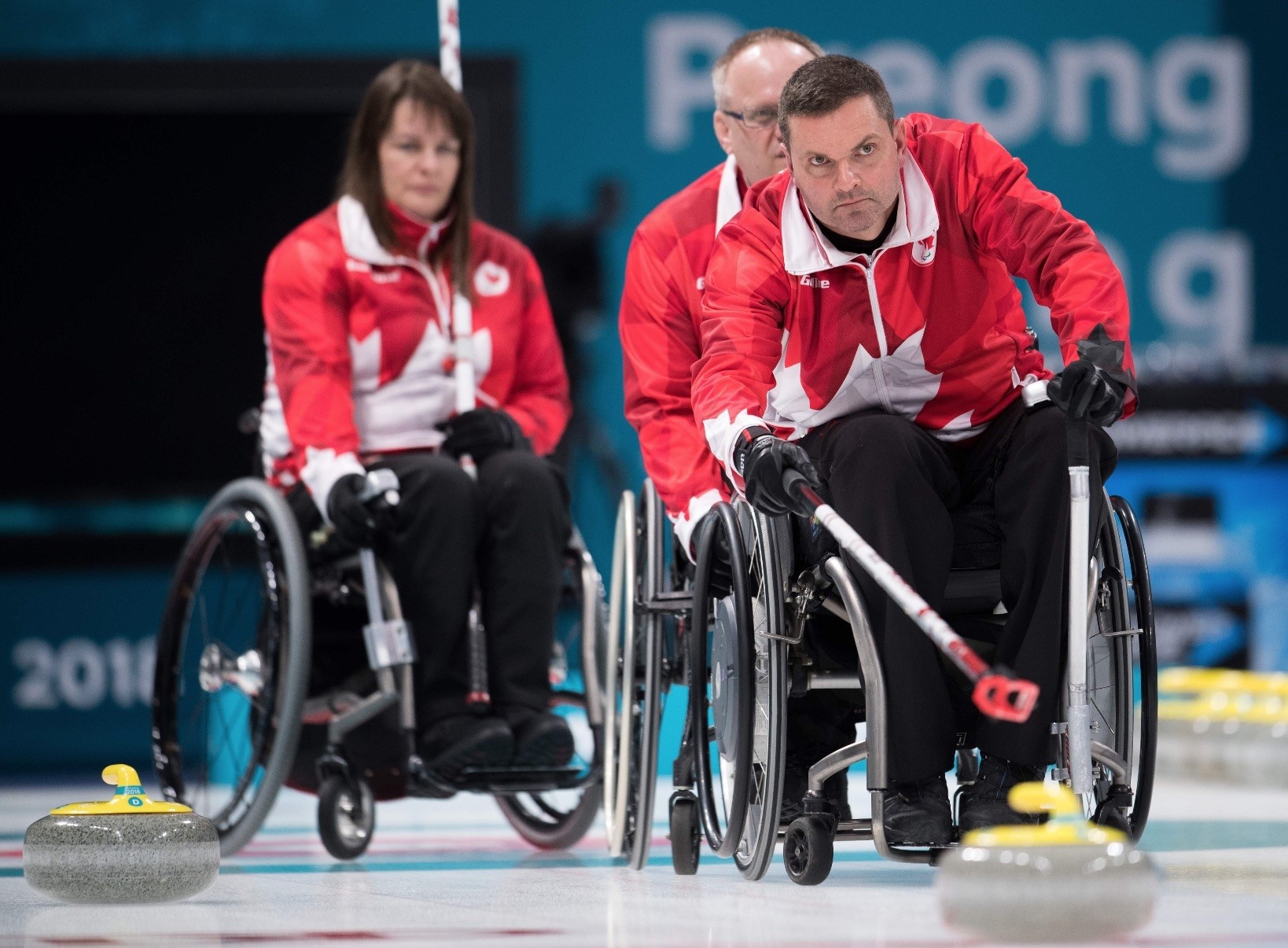 Canadau2019s Mark Ideson (R) attends a wheelchair curling practice ahead of the Pyeongchang 2018 Paralympic Winter Games at the Gangneung Curling Centre.