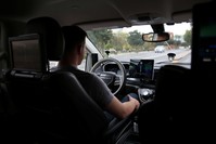 Waymo Trained Driver Derek Sirakis looks forward as the car drives during a demonstration in Chandler, Arizona, Nov. 29.